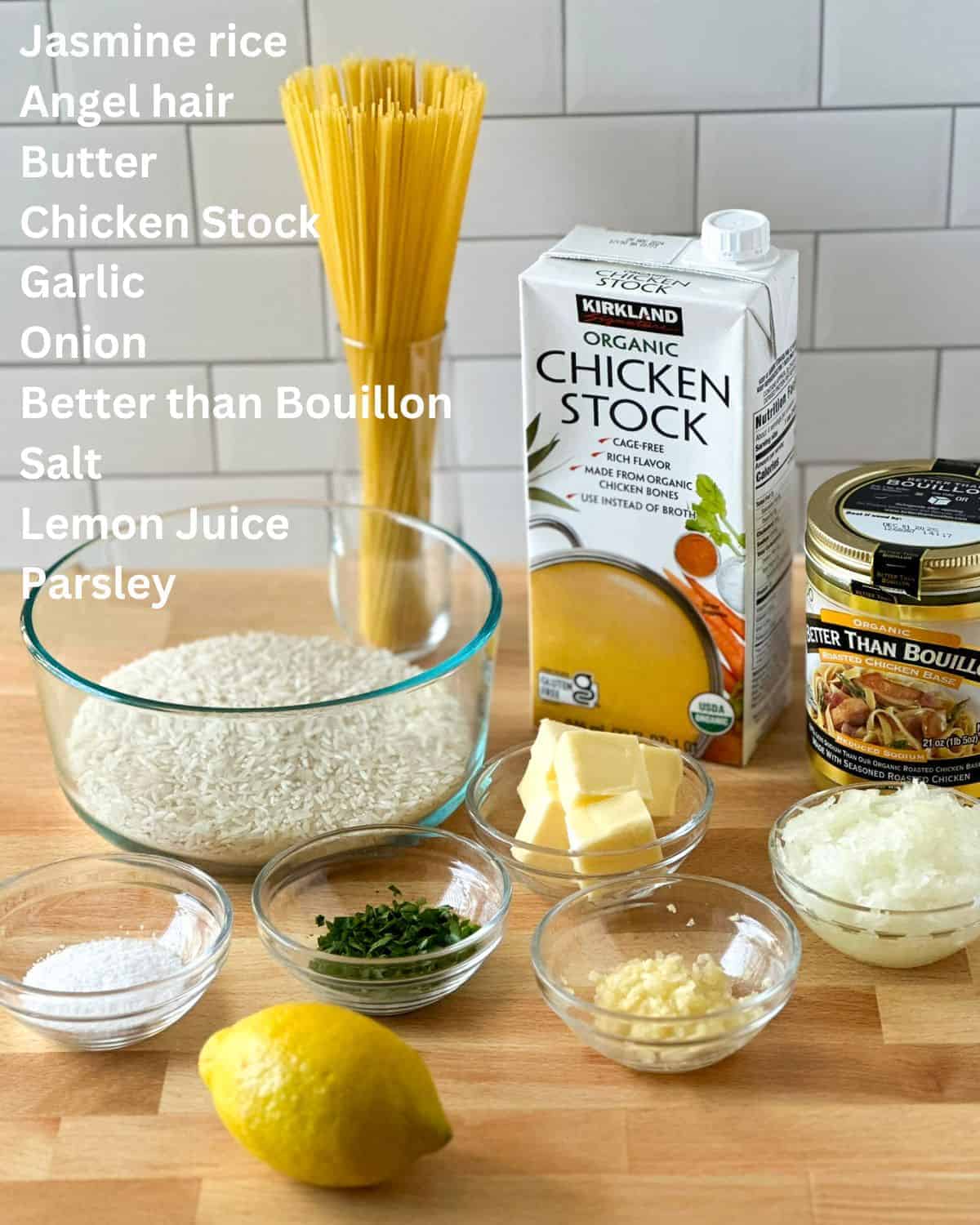 All the ingredients in this rice pilaf recipe laid out on a butcher block.