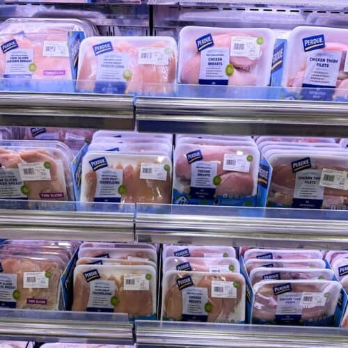 Supermarket display of chicken breast, cutlets, and tenderloins