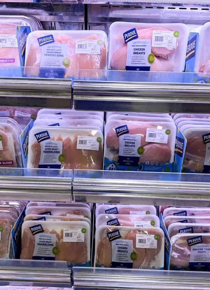 Supermarket display of chicken breast, cutlets, and tenderloins