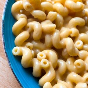 Creamy stovetop mac and cheese on a blue plate