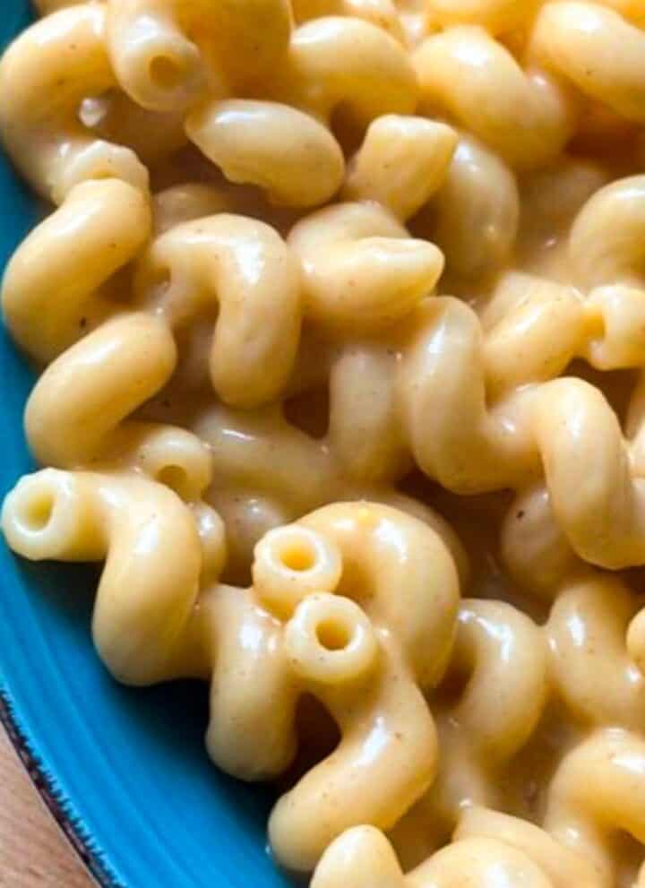 Creamy stovetop mac and cheese on a blue plate