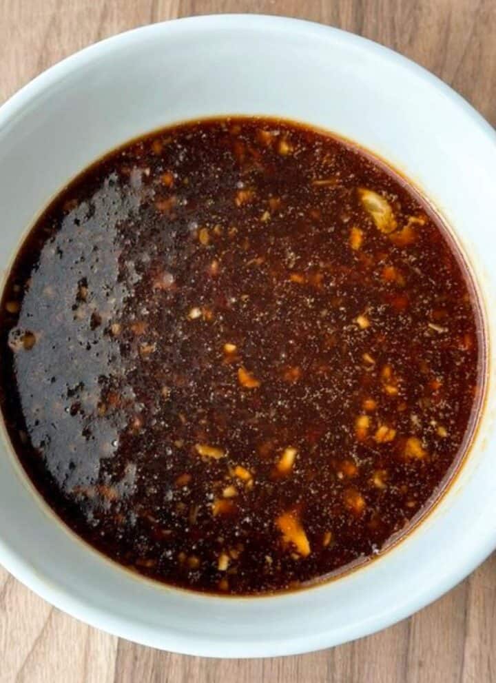 White bowl full of honey soy marinade