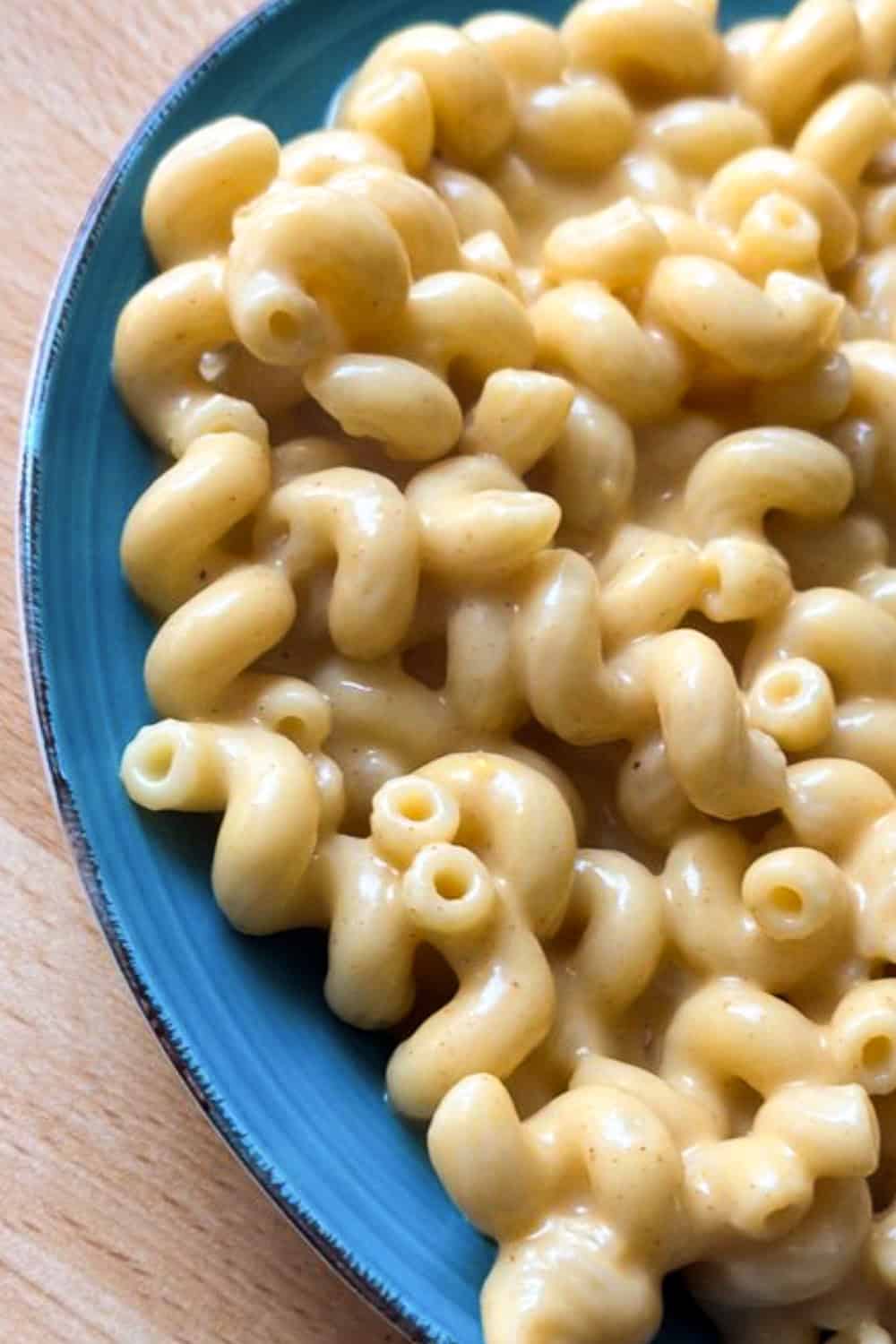 Creamy stovetop mac and cheese on a blue plate